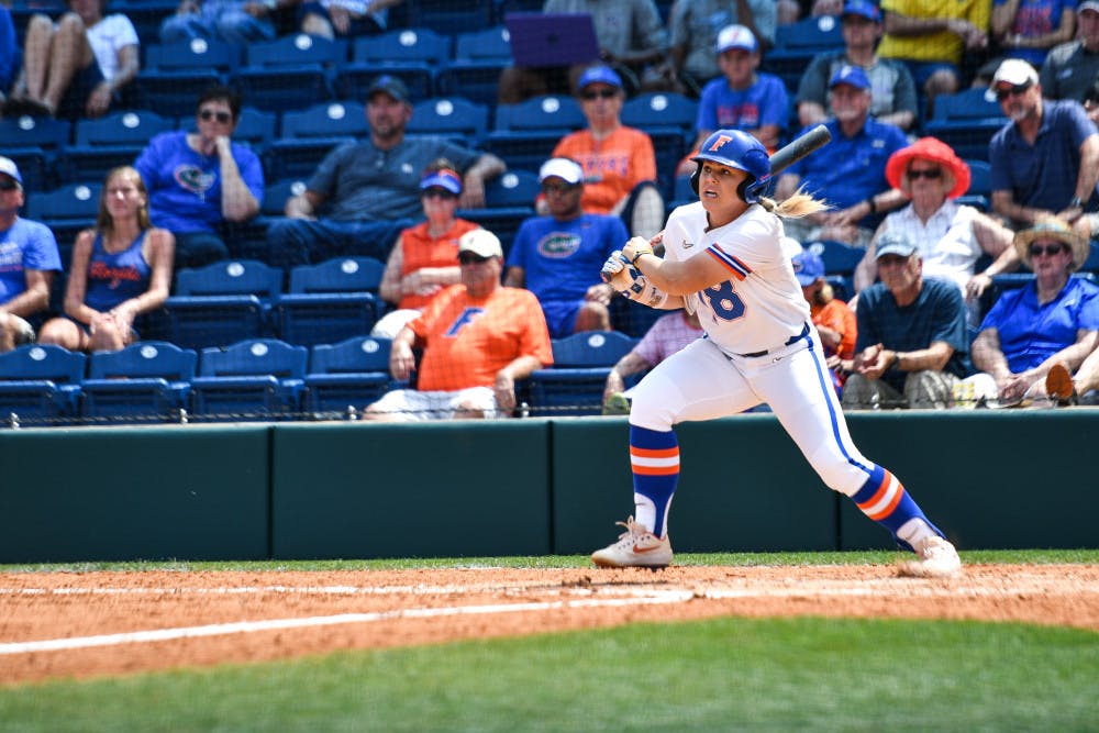 The Gators edged past Alabama to win their second-straight SEC Tournament championship behind Kelly Barnhill's brilliant outing and Amanda Lorenz's two-RBI double.