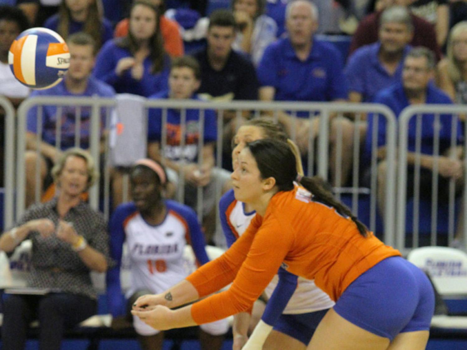 Taylor Unroe reaches for the ball during Florida’s three-set victory against FSU on Tuesday in the O’Connell Center.