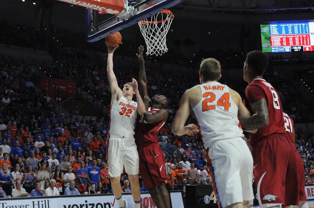 <p>UF center&nbsp;Schuyler Rimmer attempts a lay-up during Florida's 78-65 win against Arkansas on March 1, 2017, in the O'Connell Center.&nbsp;</p>