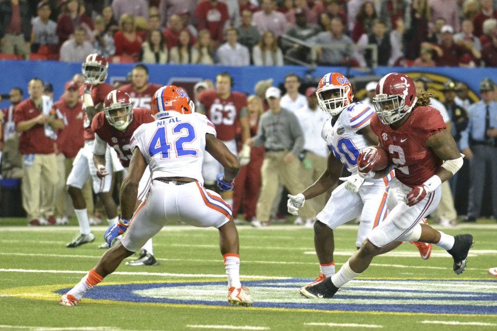 <p>UF safety Keanu Neal prepares to tackle Derrick Henry during the 2015 Southeastern Conference Championship Game</p>
