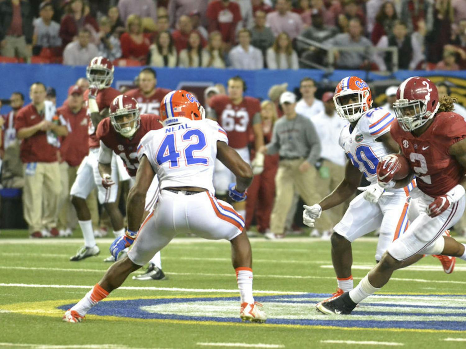 UF safety Keanu Neal prepares to tackle Derrick Henry during the 2015 Southeastern Conference Championship Game