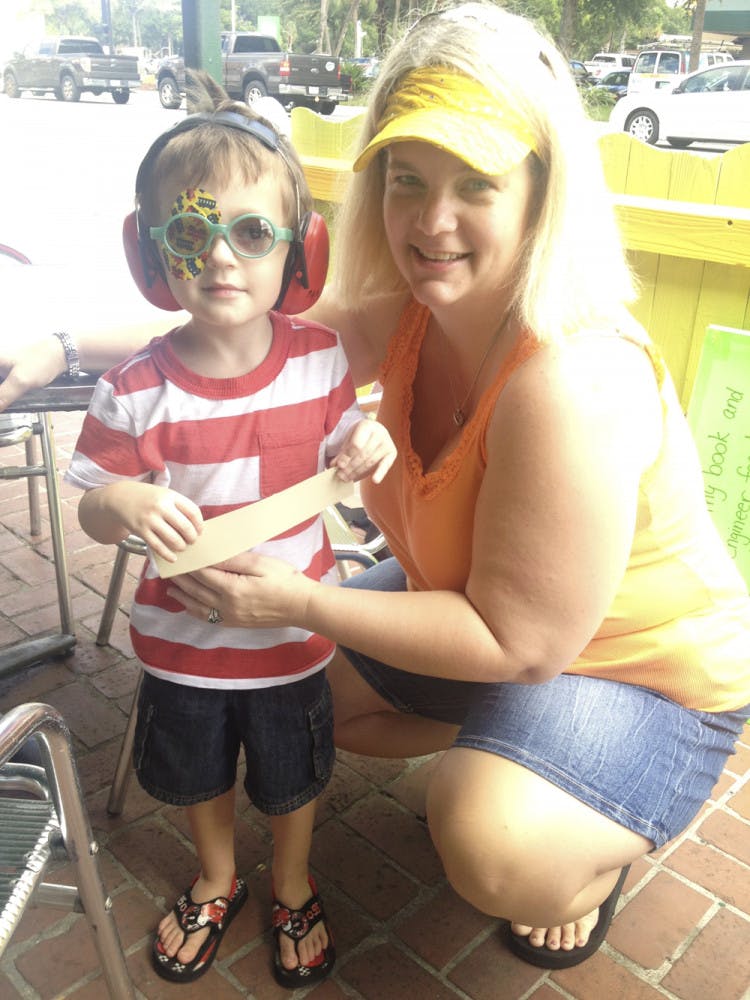 Stephanie Dunnam, 40, and her son, Heston Dunnam, 4, pose at Leonardo’s Pizza By the Slice on University Avenue on Tuesday.