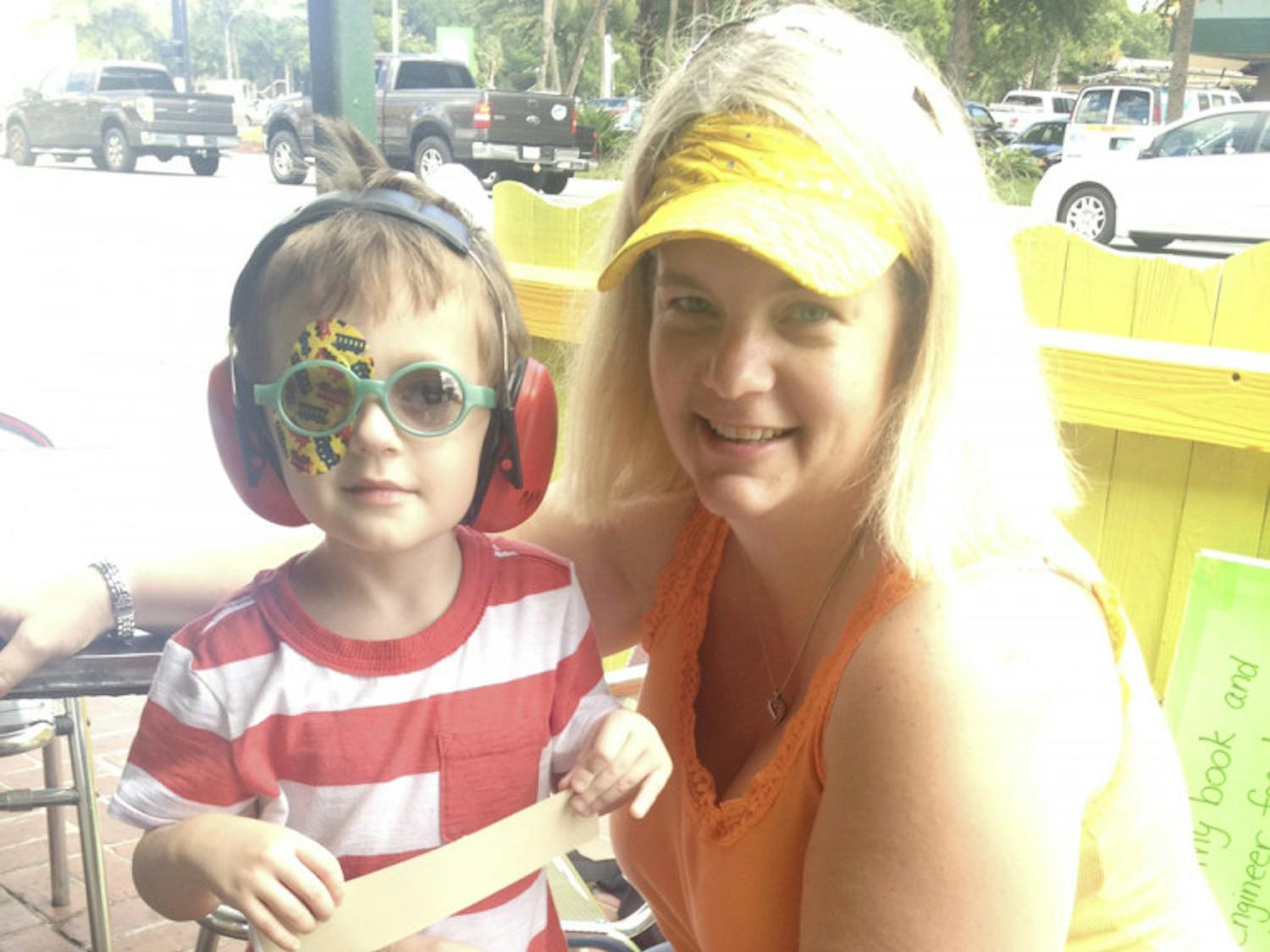 Stephanie Dunnam, 40, and her son, Heston Dunnam, 4, pose at Leonardo’s Pizza By the Slice on University Avenue on Tuesday.