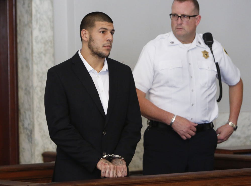 <p>Aaron Hernandez, left, appears at Attleboro District Court on Wednesday in Attleboro, Mass. Hernandez has pleaded not guilty to murder in the death of Odin Lloyd. </p>