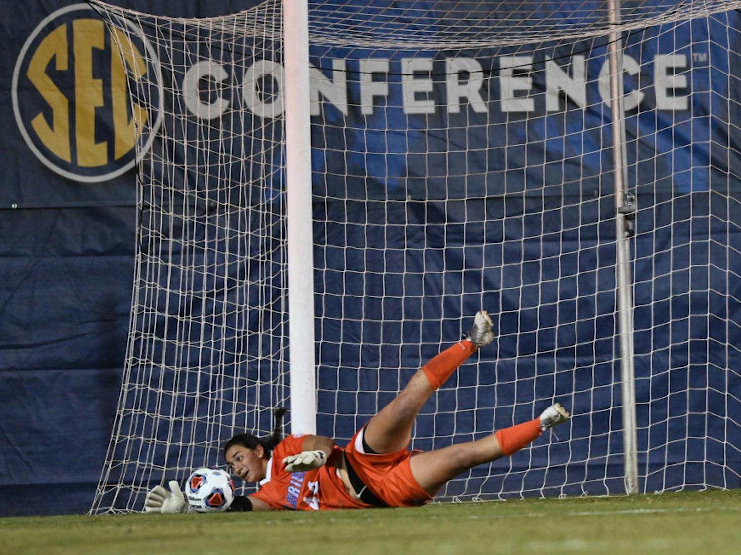 Goalkeeper Susi Espinoza dives for a save in the opening game of the SEC Tournament on Friday. After winning 6-5 in overtime on Nov. 13, the Gators tournament hopes were dashed Sunday night when they lost to Missouri.