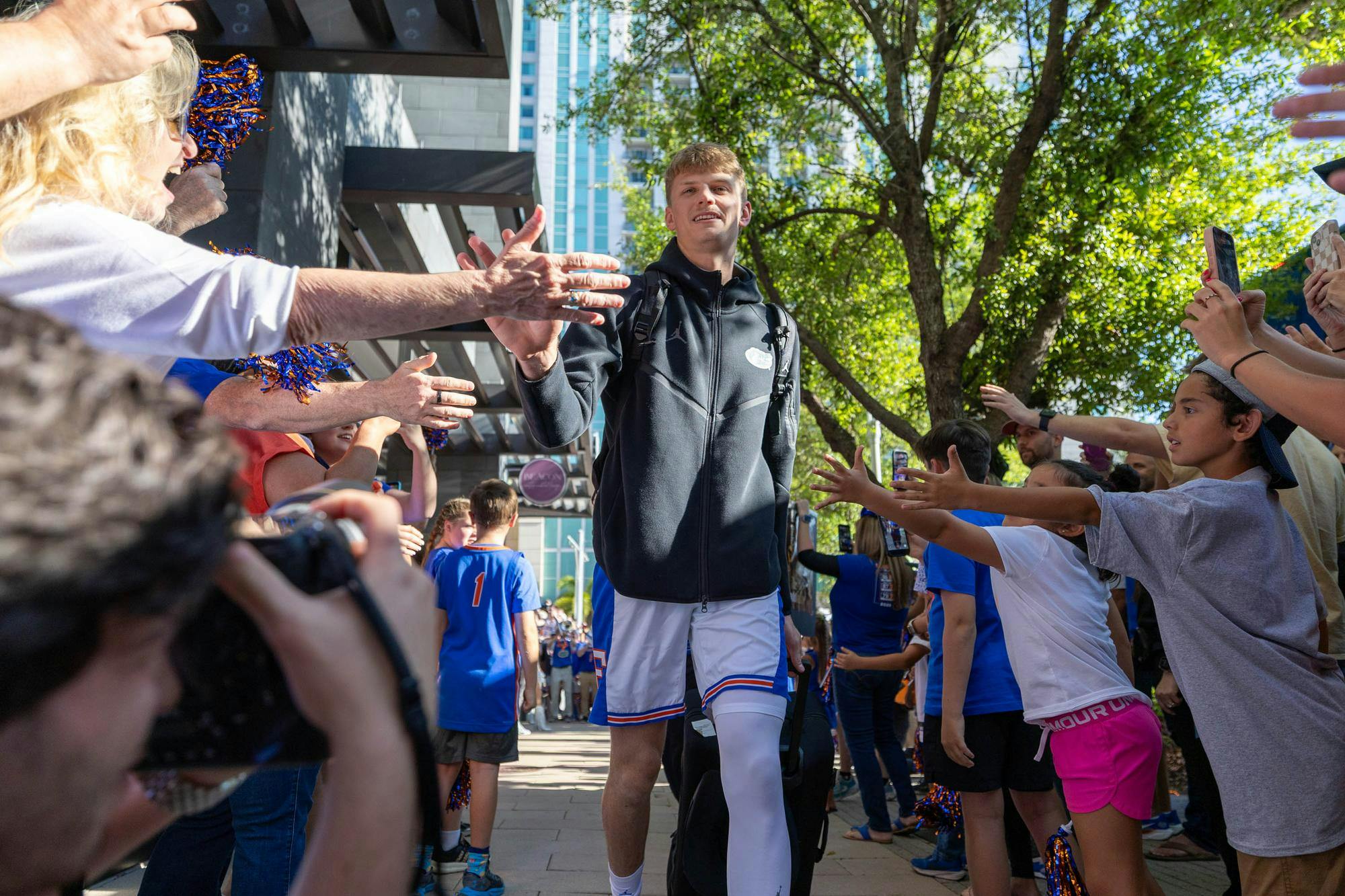 Florida forward Thomas Haugh walks through GatorWalk, Sunday, March 22, 2026, in front of the JW Marriott, in Tampa, Fla.