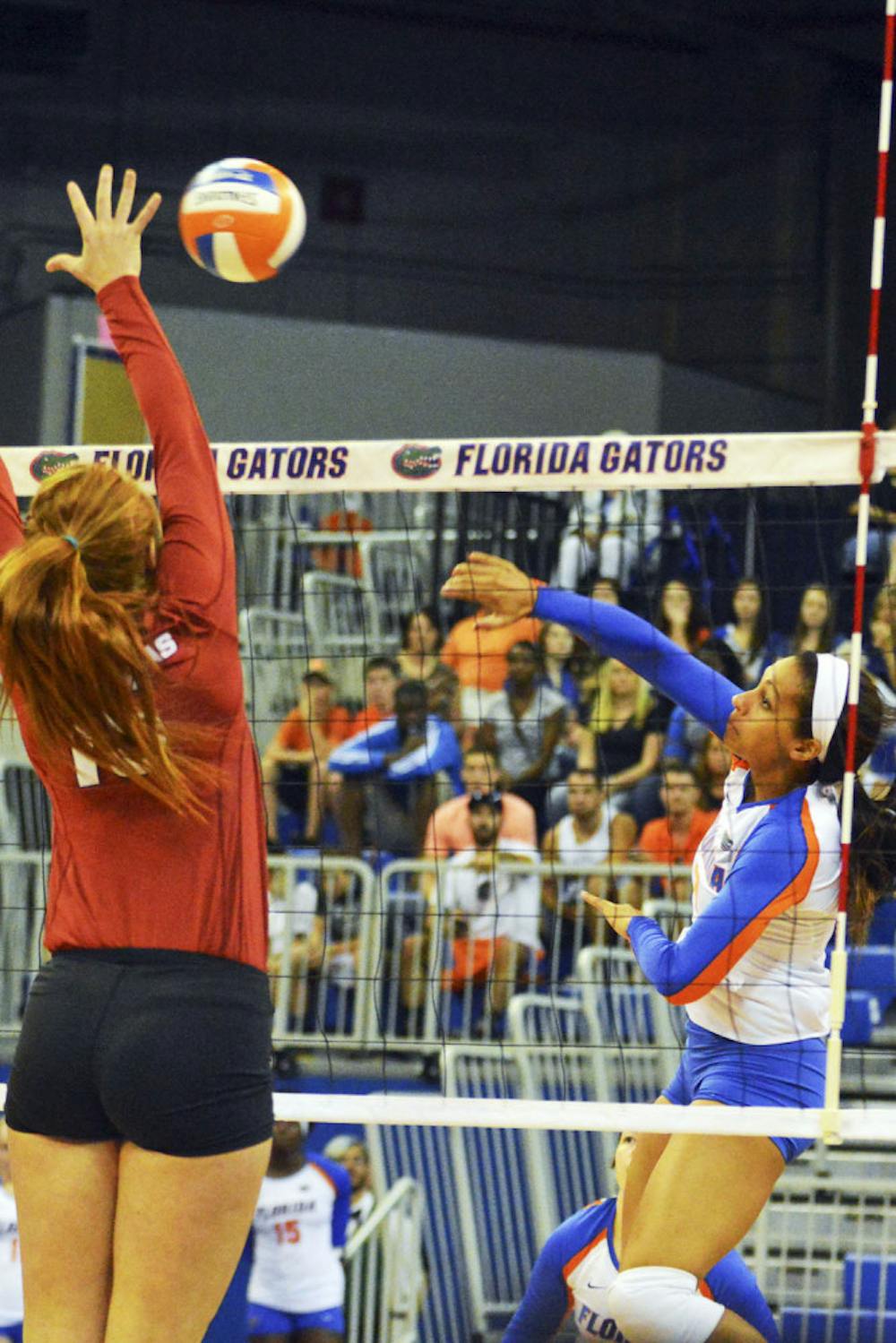 <p>Gabby Mallette swings for a kill attempt during Florida's 3-0 win against Arkansas on Sunday.</p>