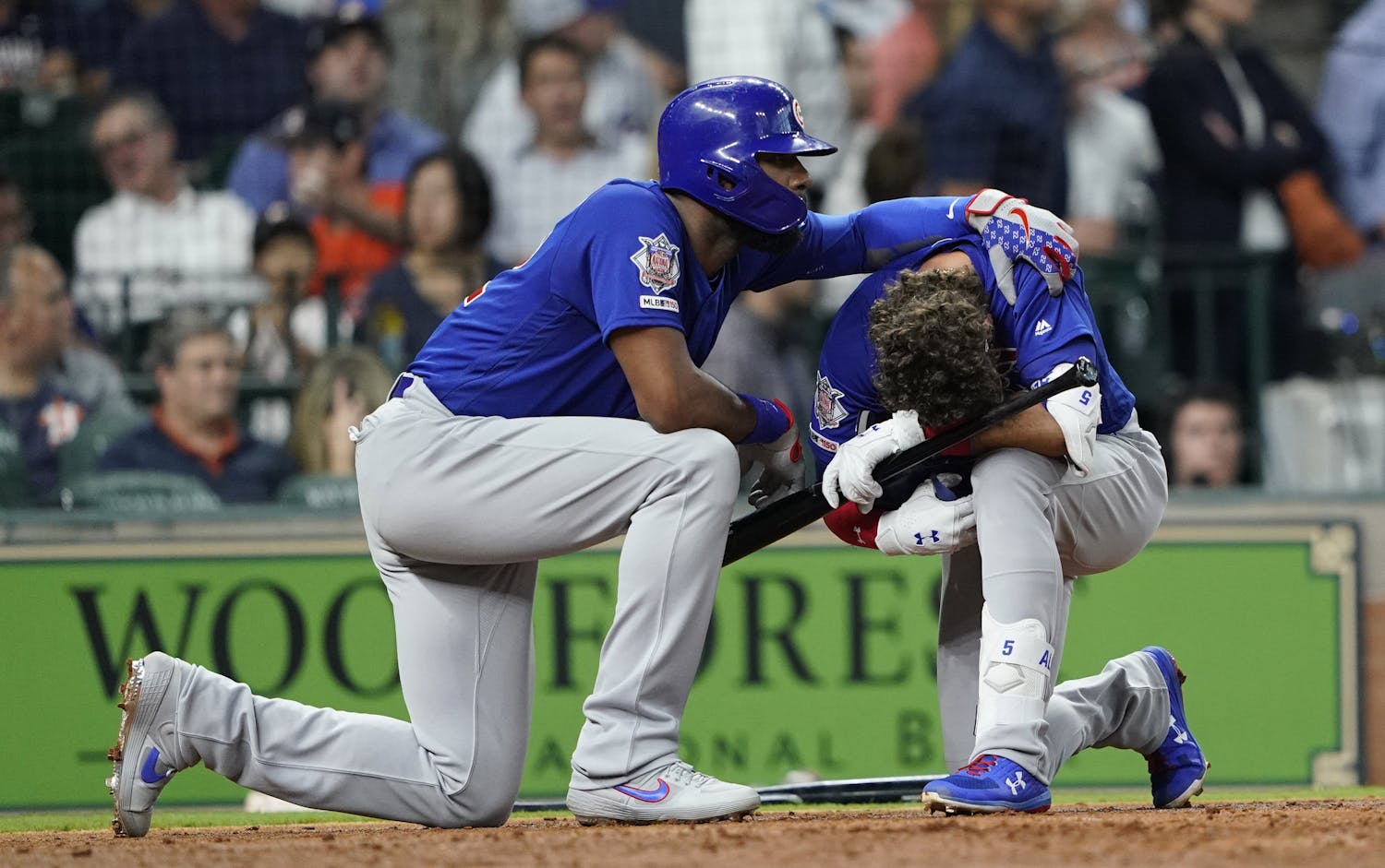 Chicago Cubs' Albert Almora Jr., right, is comforted by Jason Heyward after hitting a foul ball into the stands during the fourth inning of a baseball game against the Houston Astros Wednesday, May 29, 2019, in Houston. (AP Photo/David J. Phillip)  