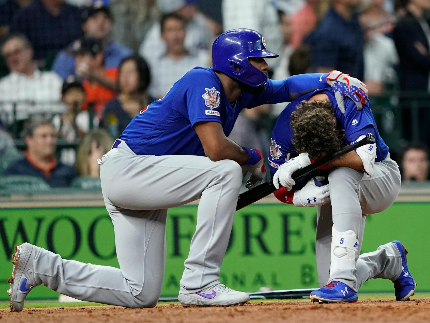 Chicago Cubs' Albert Almora Jr., right, is comforted by Jason Heyward after hitting a foul ball into the stands during the fourth inning of a baseball game against the Houston Astros Wednesday, May 29, 2019, in Houston. (AP Photo/David J. Phillip)