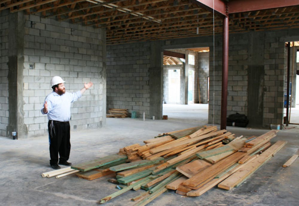 <p>Rabbi Berl Goldman, executive director of the Tabacinic Lubavitch-Chabad Jewish Student and Community Center, at 2021 NW Fifth Ave., stands in the site of the new center.</p>