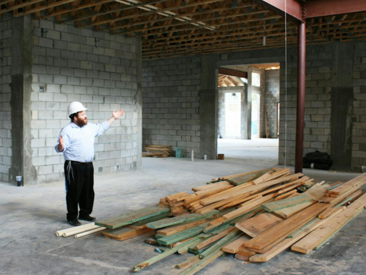 Rabbi Berl Goldman, executive director of the Tabacinic Lubavitch-Chabad Jewish Student and Community Center, at 2021 NW Fifth Ave., stands in the site of the new center.