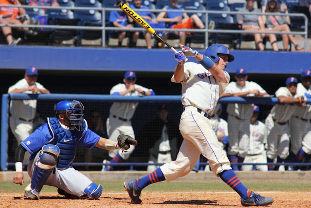 <p class="p1"><span class="s1">Catcher Taylor Gushue (17) swings during Florida’s 11-5 loss to Kentucky on March 16 at McKethan Stadium. Gushue finished the game 1 for 4 at the plate.</span></p>