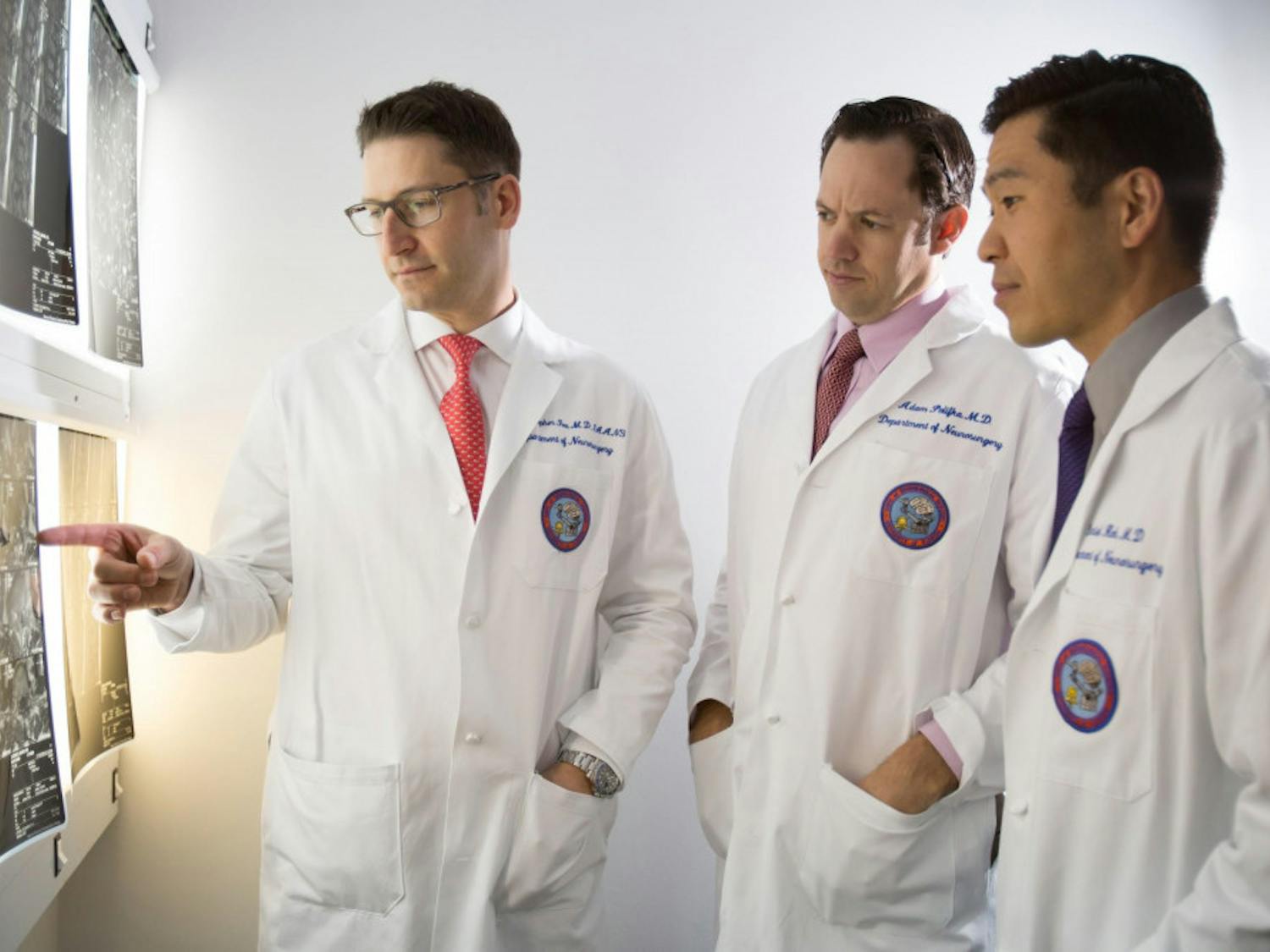 (From left) UF Health neurosurgeons Dr. William Fox, Dr. Adam Polifka and Dr. Daniel Hoh are part of a multidisciplinary team improving care for patients with back and neck pain at the UF Health Comprehensive Spine Center.