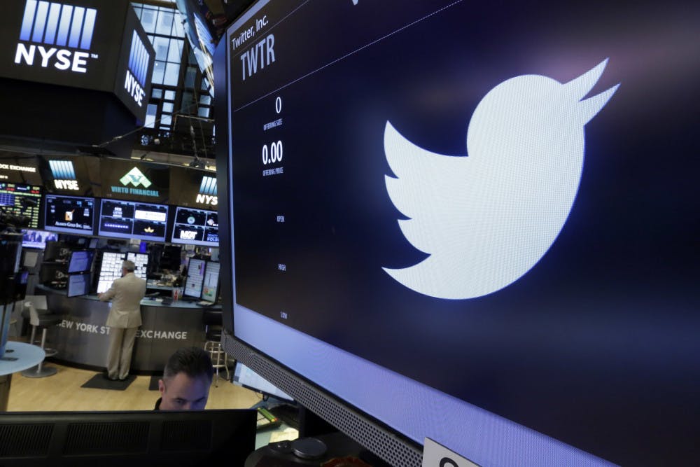 The Twitter logo appears at the post where it trades, on the floor of the New York Stock Exchange, Friday, June 17, 2016. (AP Photo/Richard Drew)