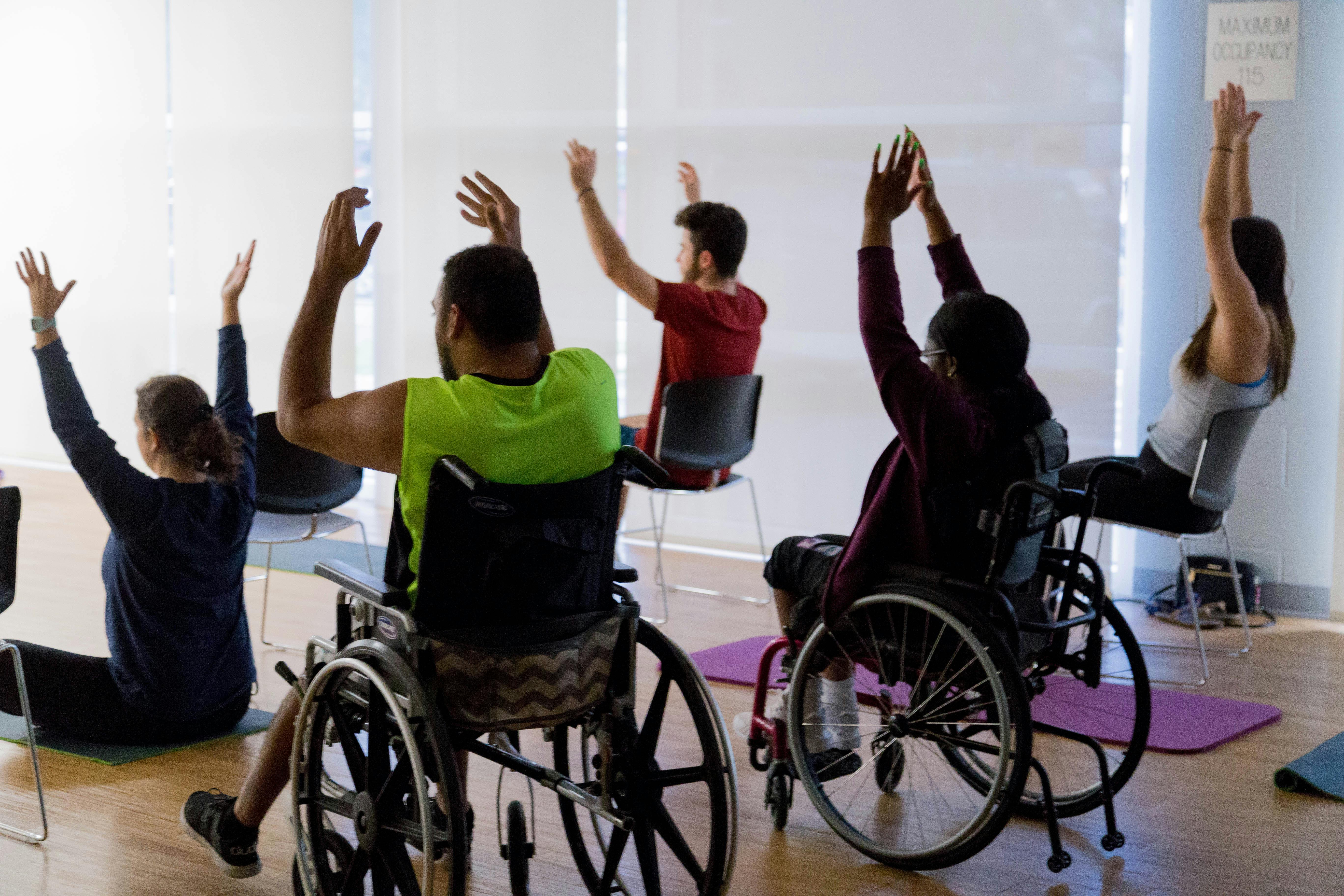 UF students participating in yoga class put on by UF's Disability and Resource Center.