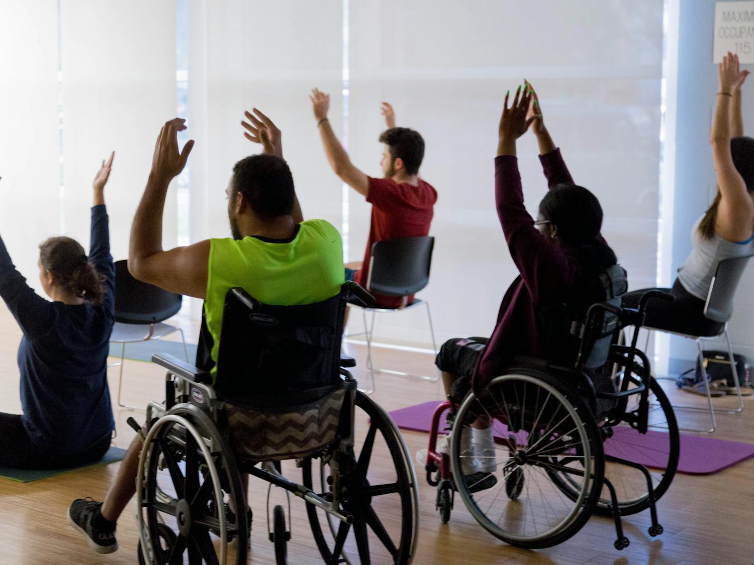 UF students participating in yoga class put on by UF's Disability and Resource Center.