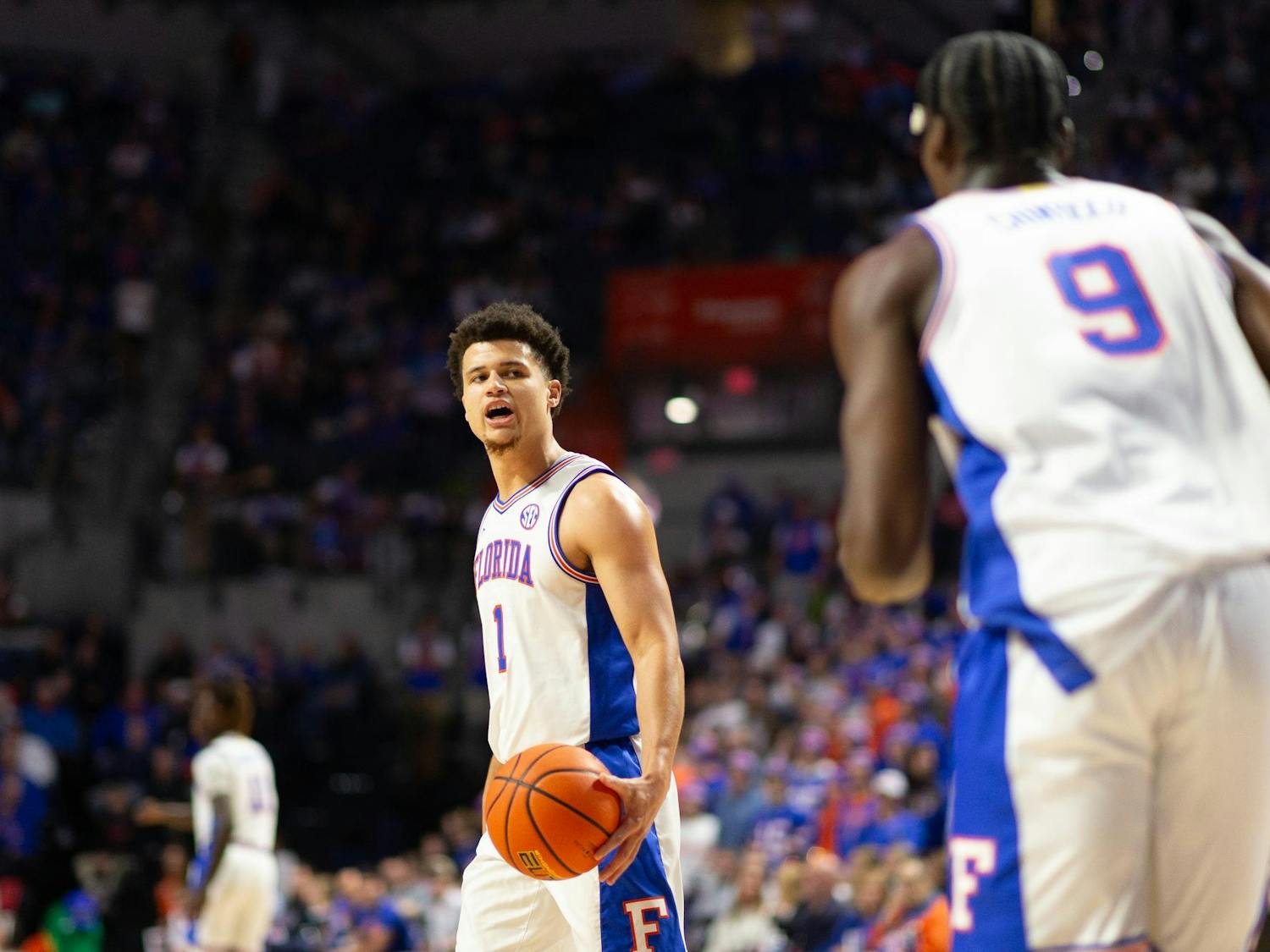 Florida Gators Guard Walter Clayton Jr. (1) calls out a play to Florida Gators Center Rueben Chinyelu (9) during the first half against the Virginia Cavaliers at Exactech Arena at the Stephen C. O'Connell Center on Wednesday, Dec. 4, 2024.