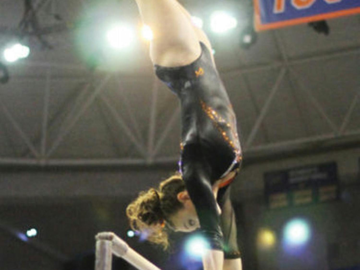 Kiersten Wang performs on the uneven bars during Florida’s win against Kentucky on Feb 22, 2013.