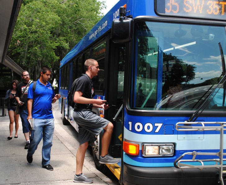 UF residents board an RTS bus Monday. Bus routes will be altered for the term break beginning Saturday.&nbsp;
