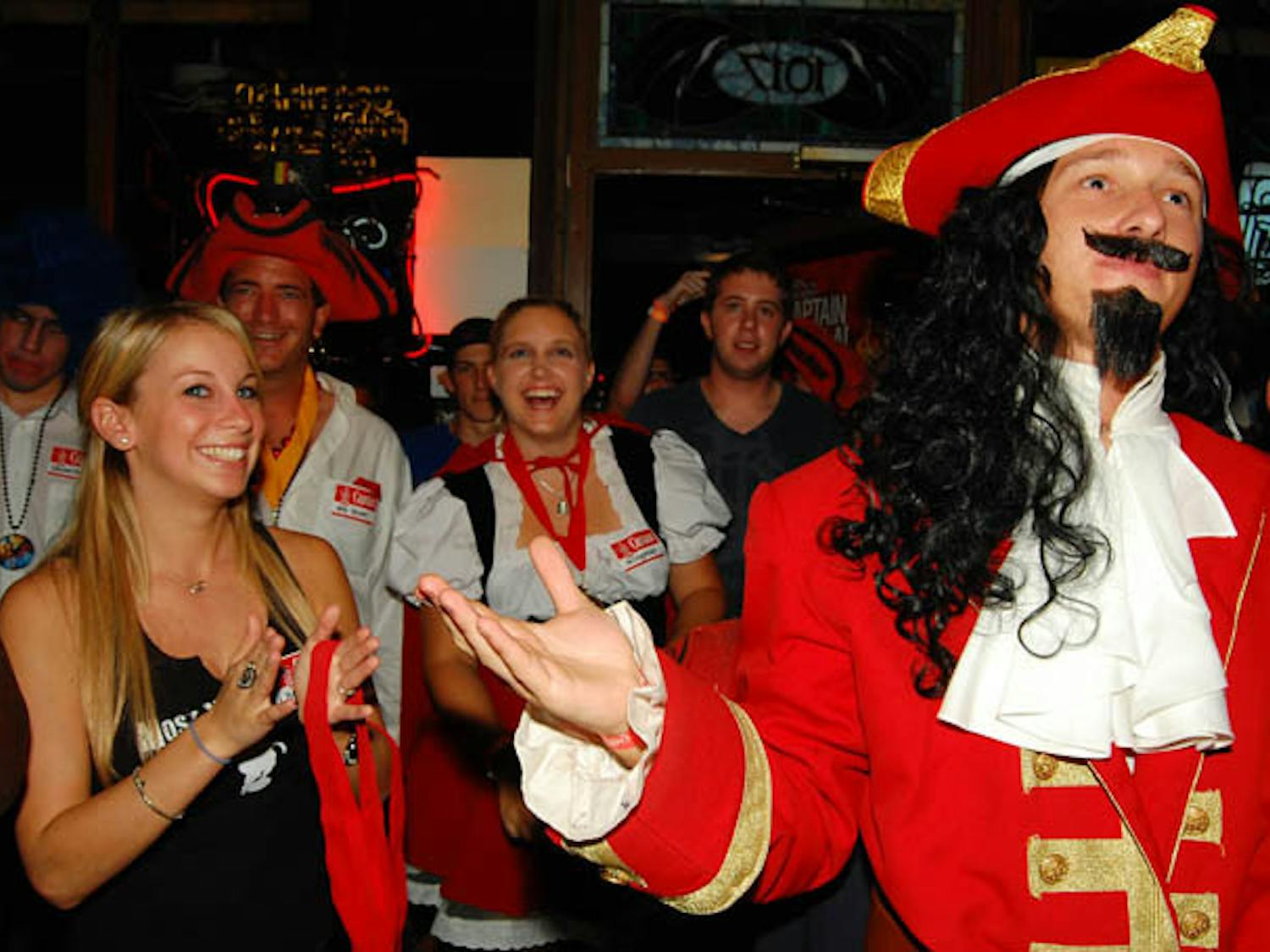 “The Captain” selects a winner for a Halloween costume contest at Mothers Pub and Grill on 1017 W. University Ave.