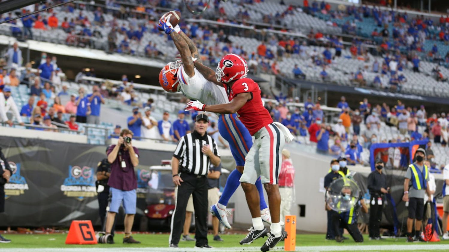 Wide receiver Trevon Grimes stretches to catch the football ball thrown by Gators quarterback Kyle Trask and score a touchdown for Florida against Georgia at TIAA Bank Field on Nov. 7, 2020.