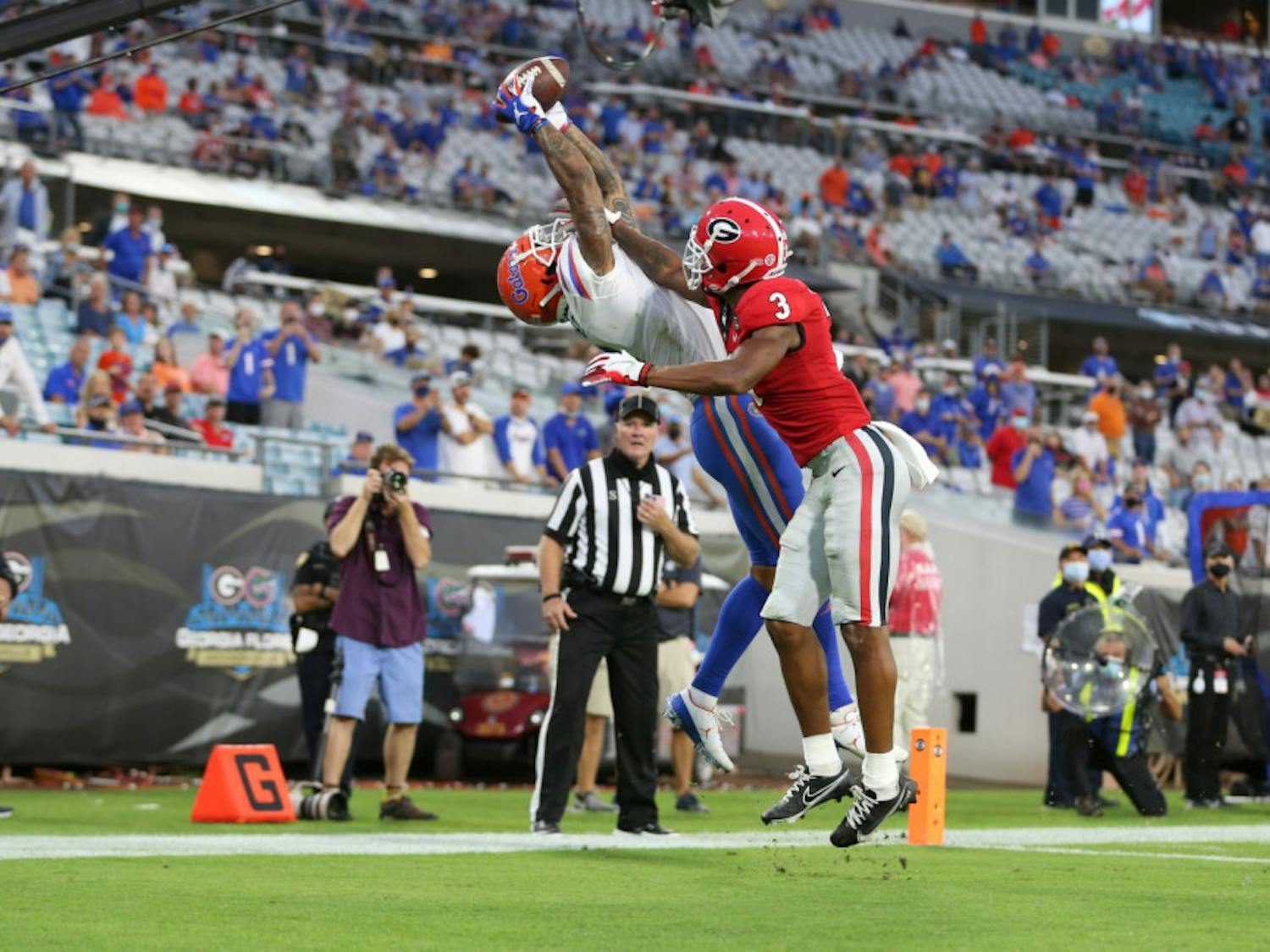 Wide receiver Trevon Grimes stretches to catch the football ball thrown by Gators quarterback Kyle Trask and score a touchdown for Florida against Georgia at TIAA Bank Field on Nov. 7, 2020.
