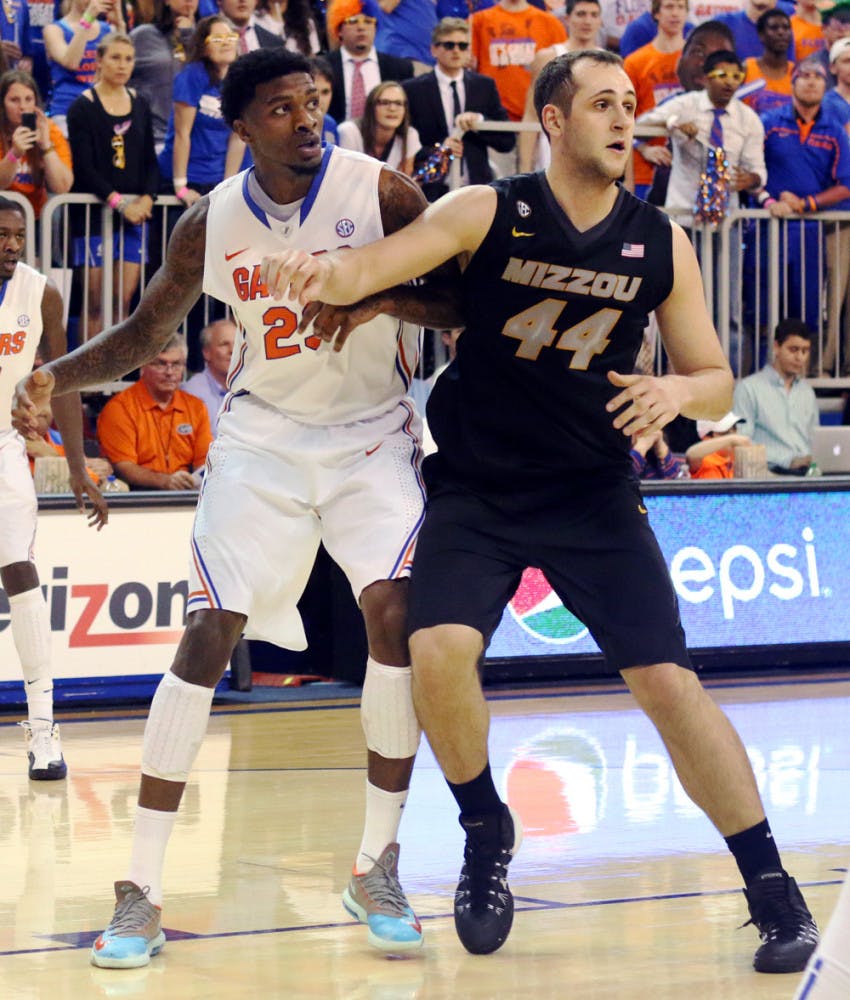 Freshman forward Chris Walker looks for a pass during Florida’s 68-58 win against Missouri on Tuesday in the O’Connell Center.