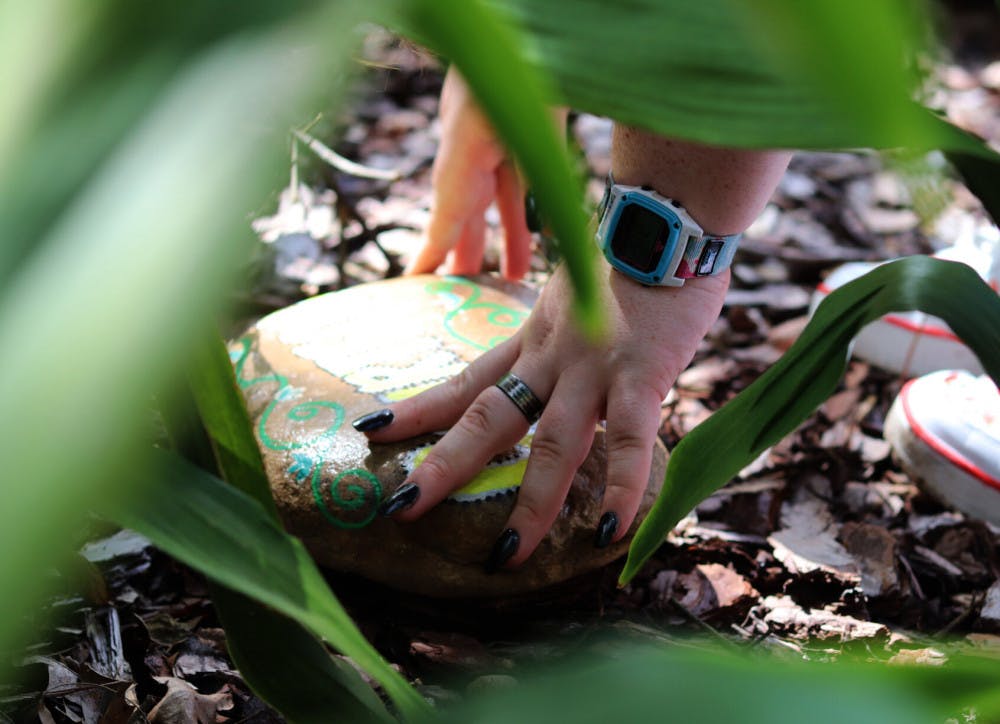 Scout picks up healing stone labeled "courteous"