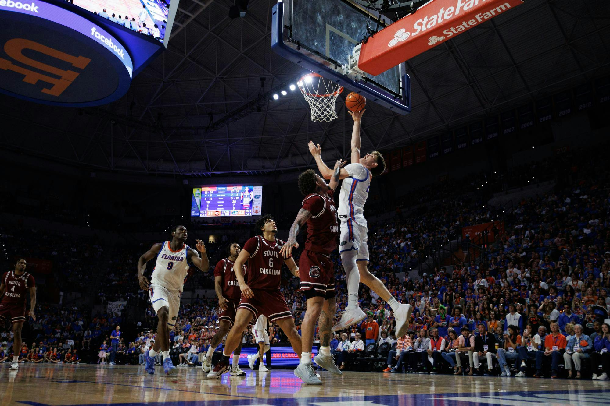 Florida forward Alex Condon (21) shoots a layup during the second half of an NCAA college basketball game against South Carolina, Tuesday, Feb. 17, 2026, in Gainesville, Fla.
