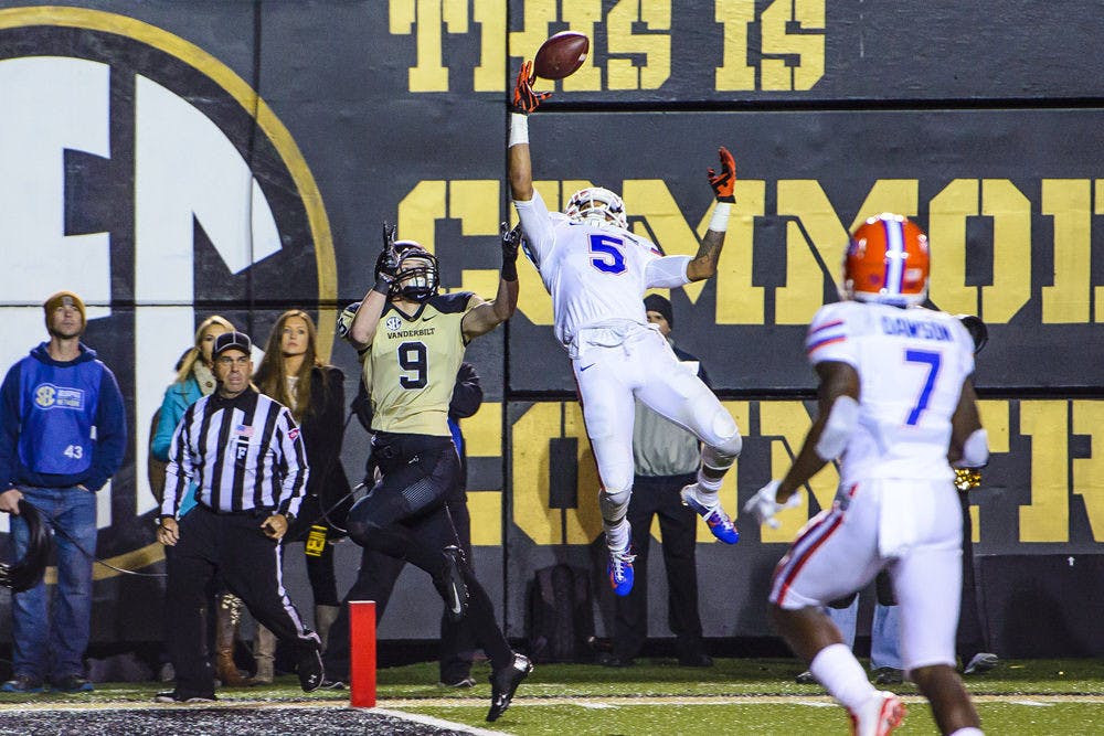 <p>Jalen Tabor records a one-handed interception during Florida's 34-10 win against Vanderbilt on Saturday.</p>