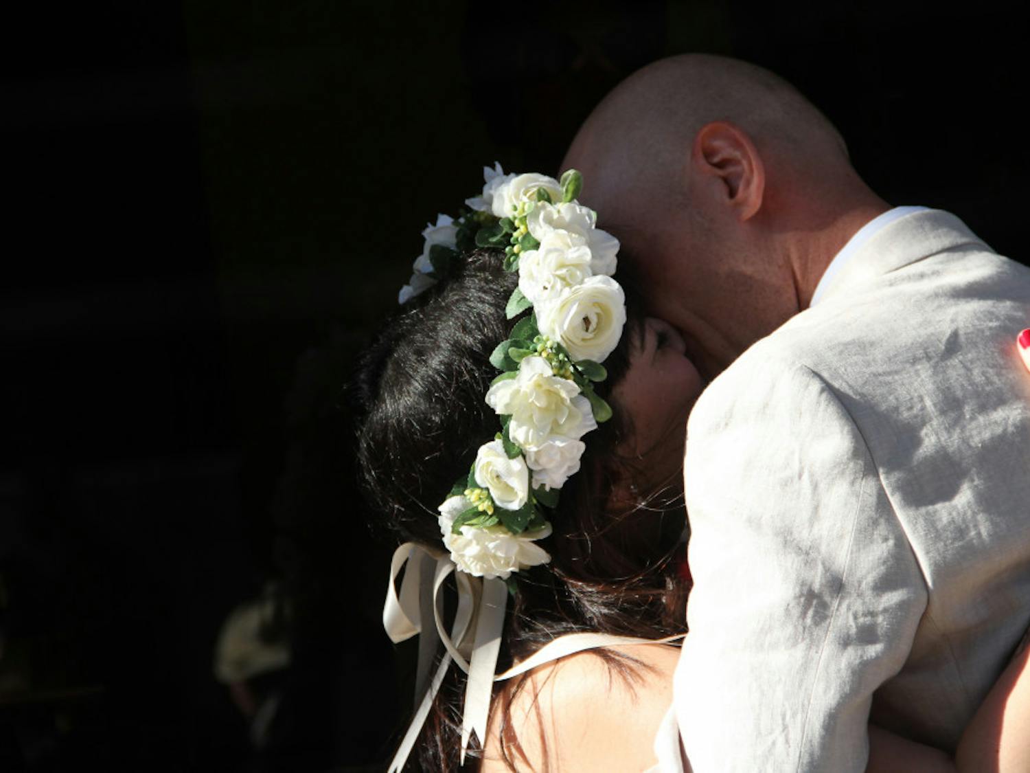 Dina Benbrahim and Kari Thorleifsson seal their marriage with a kiss at the Clerk of Court’s office Wednesday evening. 