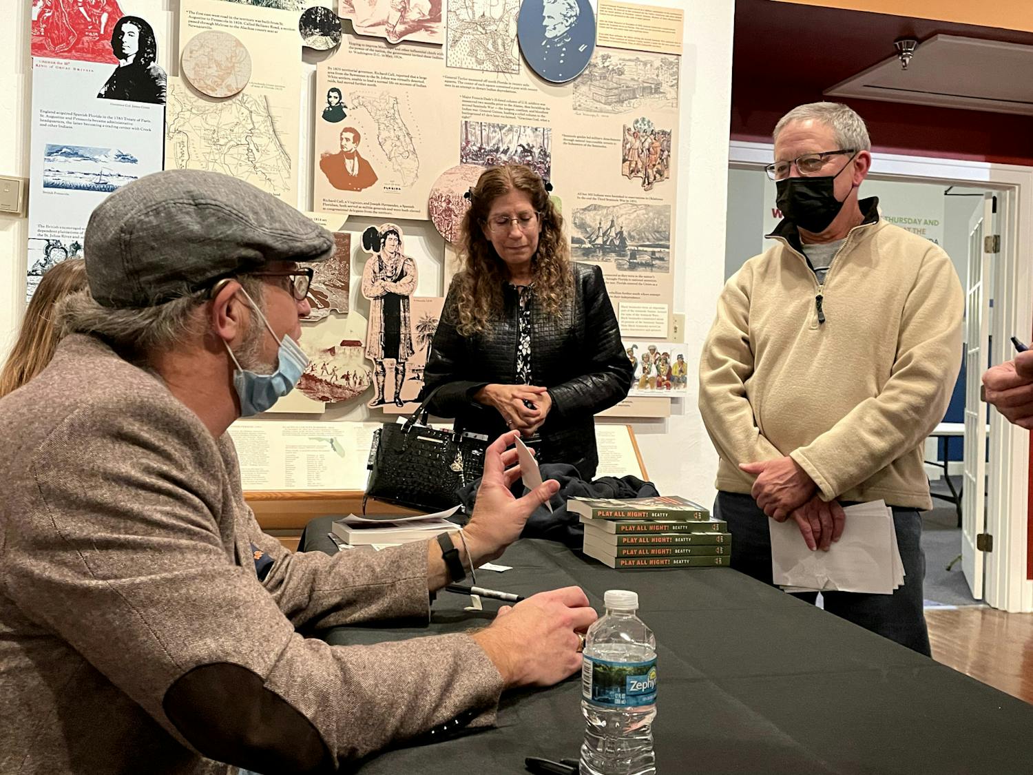 Bob Beatty (left) discusses his new book with attendees at the Matheson History Museum on Wednesday, Oct. 19, 2022.