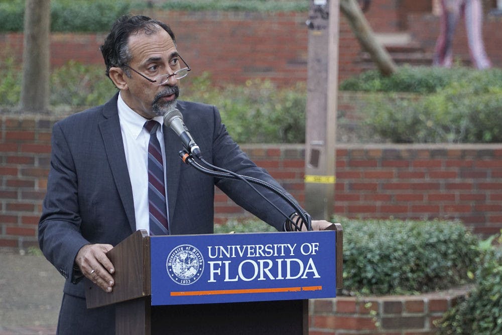 <p>Leonardo Villalon, Dean of UF’s International Center, speaks at the vigil. He said the only antidote to terror is coming together in solidarity despite cultural and religious differences.</p>