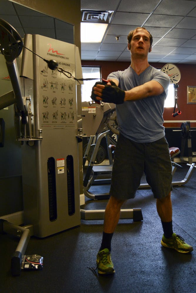 John David Eriksen, a 32-year-old software engineer and musician, works out at Alter Ego Fitness at 101 SE 2nd Place on Thursday evening.