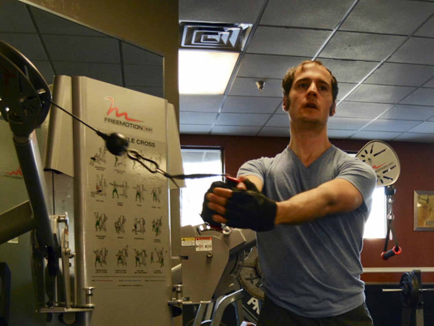 John David Eriksen, a 32-year-old software engineer and musician, works out at Alter Ego Fitness at 101 SE 2nd Place on Thursday evening.