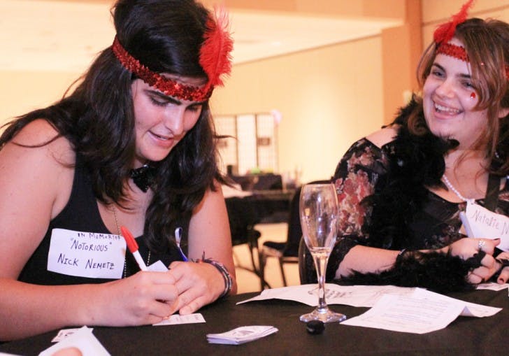 Murder at the Reitz -&nbsp;Eighteen-year-old freshmen Ryley Valenti, left, and Nadia Fernandez, dress up and play along with the Murder Mystery at the Reitz, a 1920s themed who-done-it event produced by RUB.