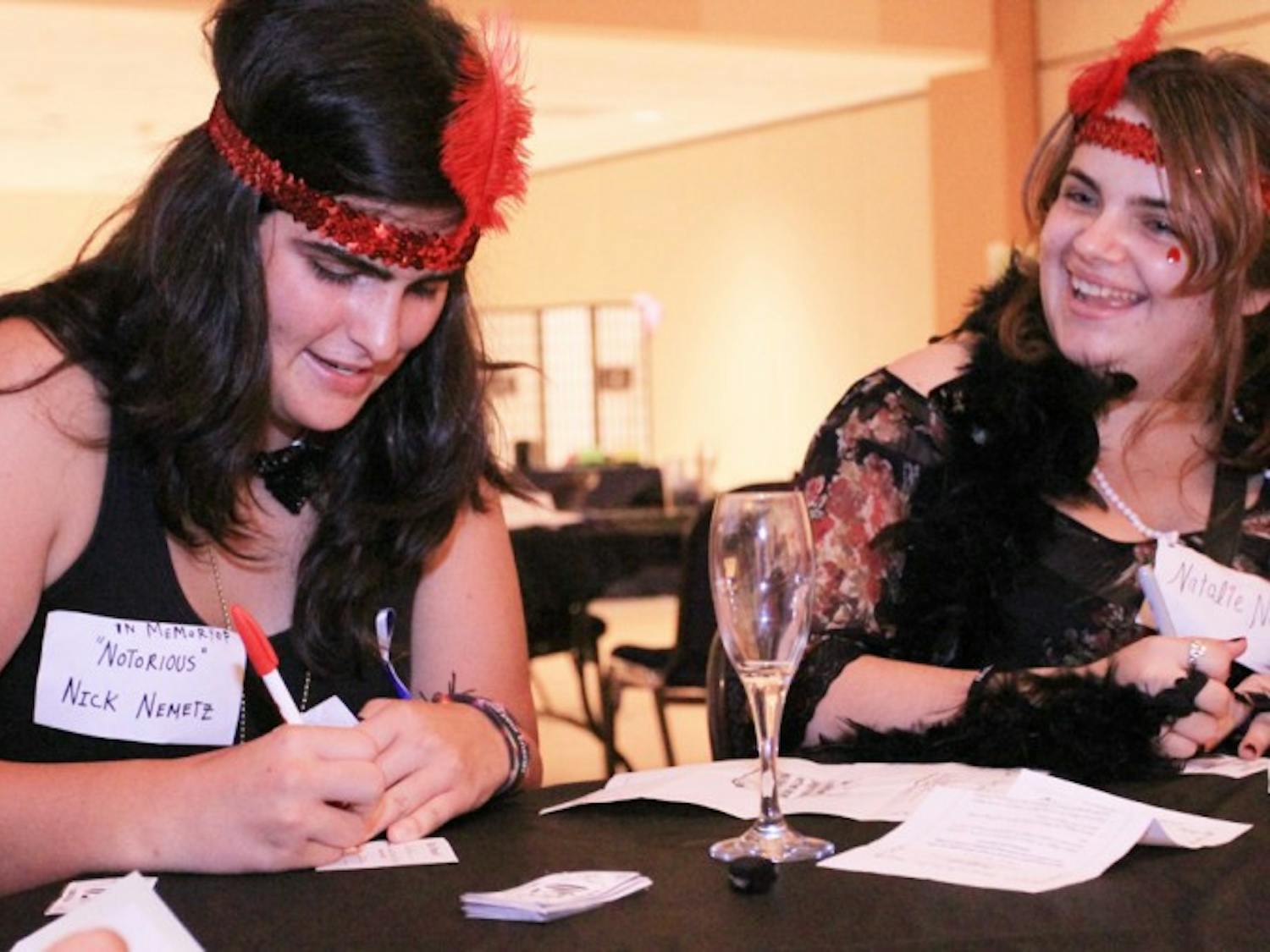 Murder at the Reitz -&nbsp;Eighteen-year-old freshmen Ryley Valenti, left, and Nadia Fernandez, dress up and play along with the Murder Mystery at the Reitz, a 1920s themed who-done-it event produced by RUB.