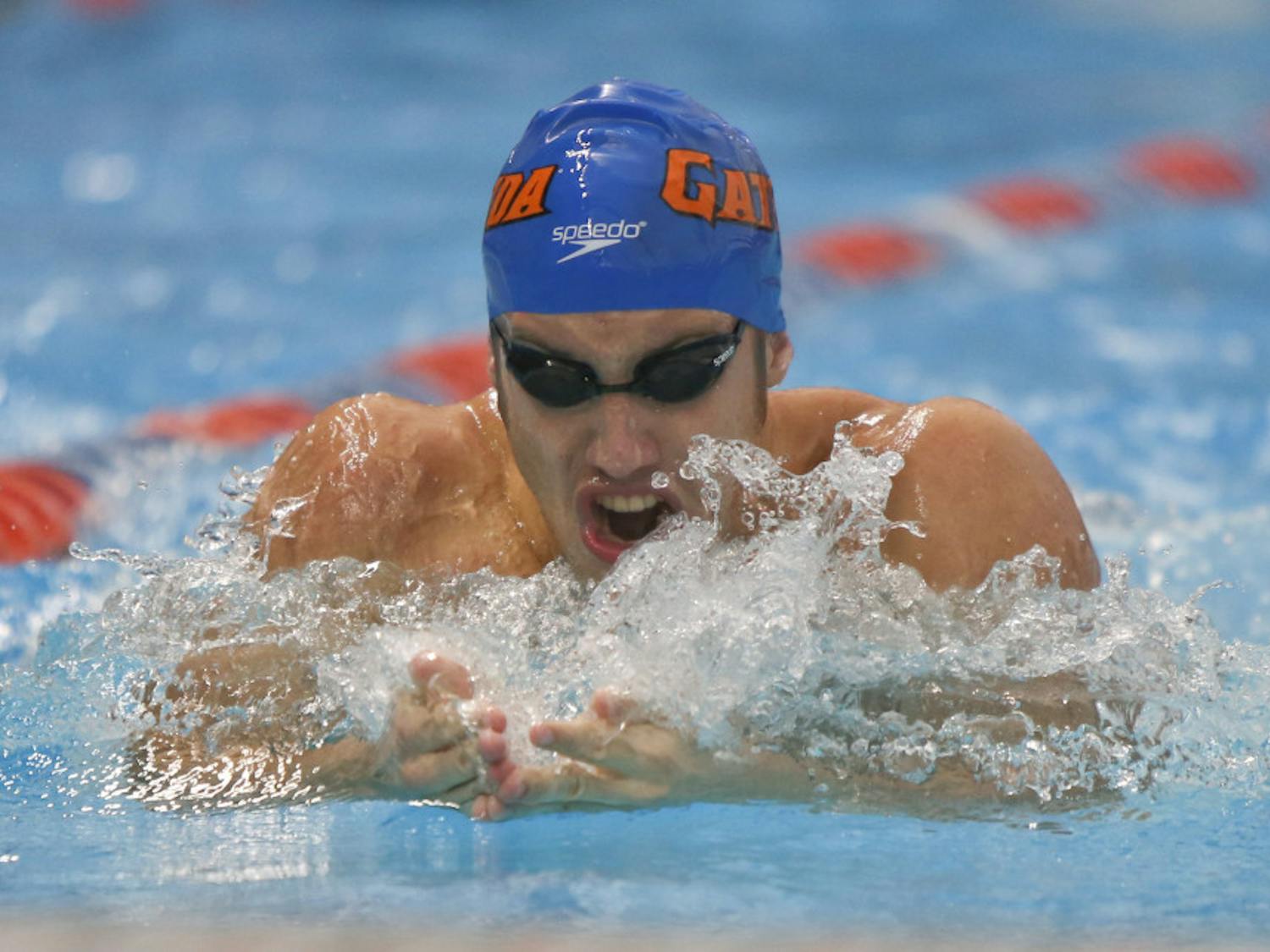 Junior Matt Elliott competes in the men's open 100 breast at the Pinch a Penny All-Florida Invitation at the Stephen C. O'Connell Center on Sept. 28.
