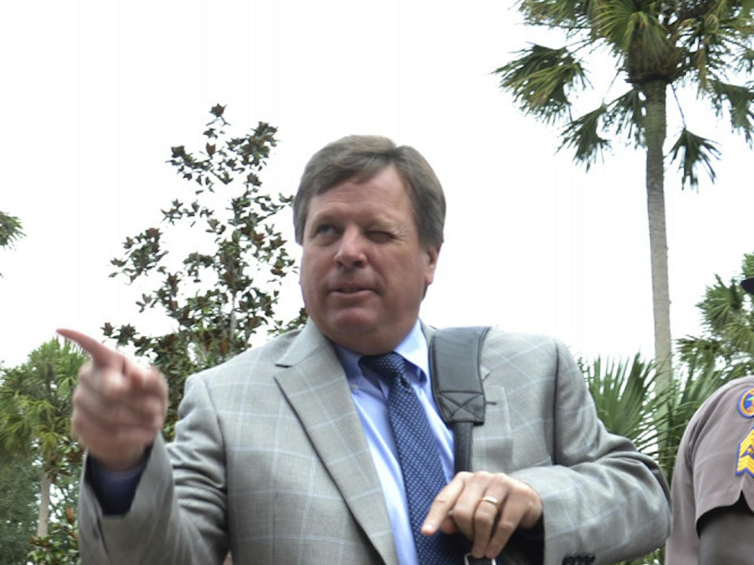 UF coach Jim McElwain points to the crowd during Gator Walk prior to Florida's 20-14 overtime win against Florida Atlantic on Nov. 21, 2015.
