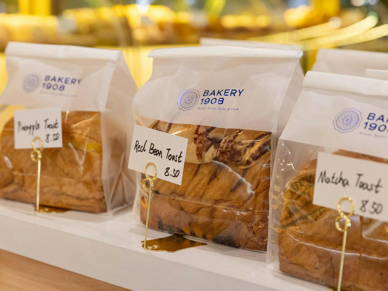 Various kinds of toast are seen on display inside of Bakery 1908 on Wednesday, Sept. 3, 2025.