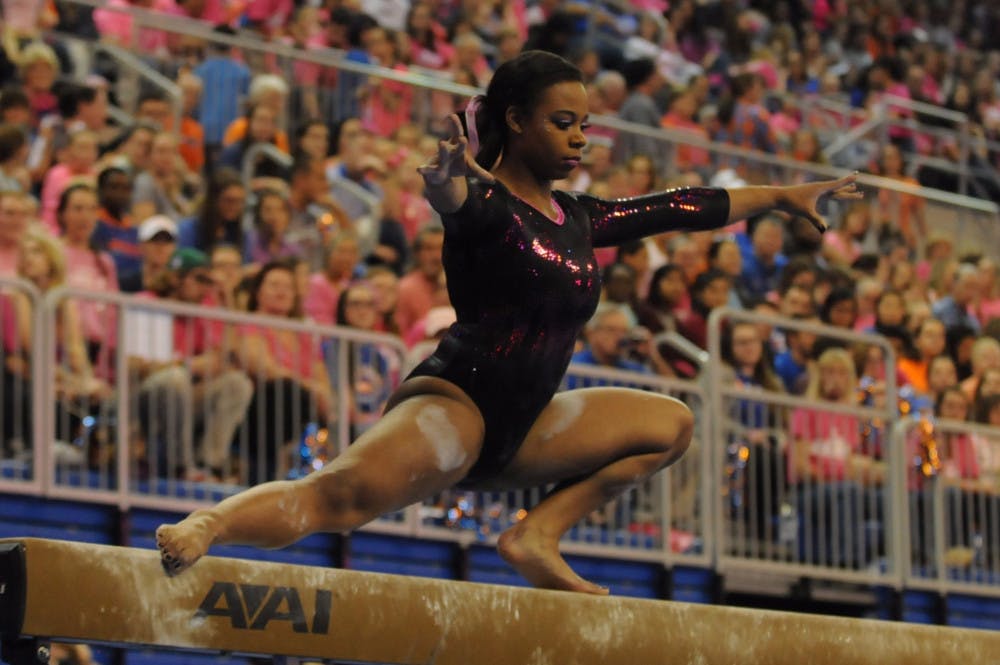 <p>Kennedy Baker performs on the balance beam during Florida's win against Arkansas on Feb. 12, 2016, in the O'Connell Center.</p>