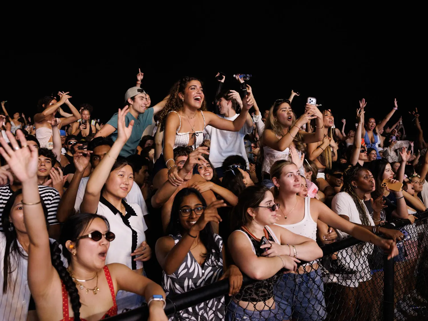 University of Florida students dance while The Chainsmokers perform during SwampFest at Flavet Field, Tuesday, April 14, 2026, in Gainesville, Fla.