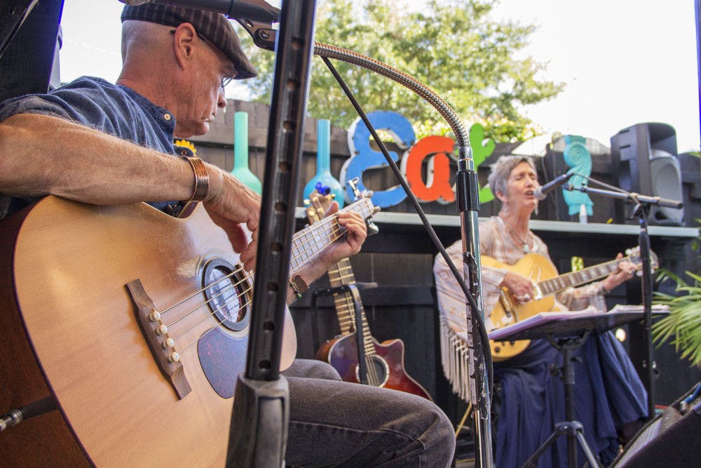 Mark Armbrecht plays the bass while his wife, Barbara, sings folk blues at Cafe C’s Sunday brunch. The couple formed a duo, Middleground, which performs every Sunday at Cafe C at 424 NW Eighth Ave.
