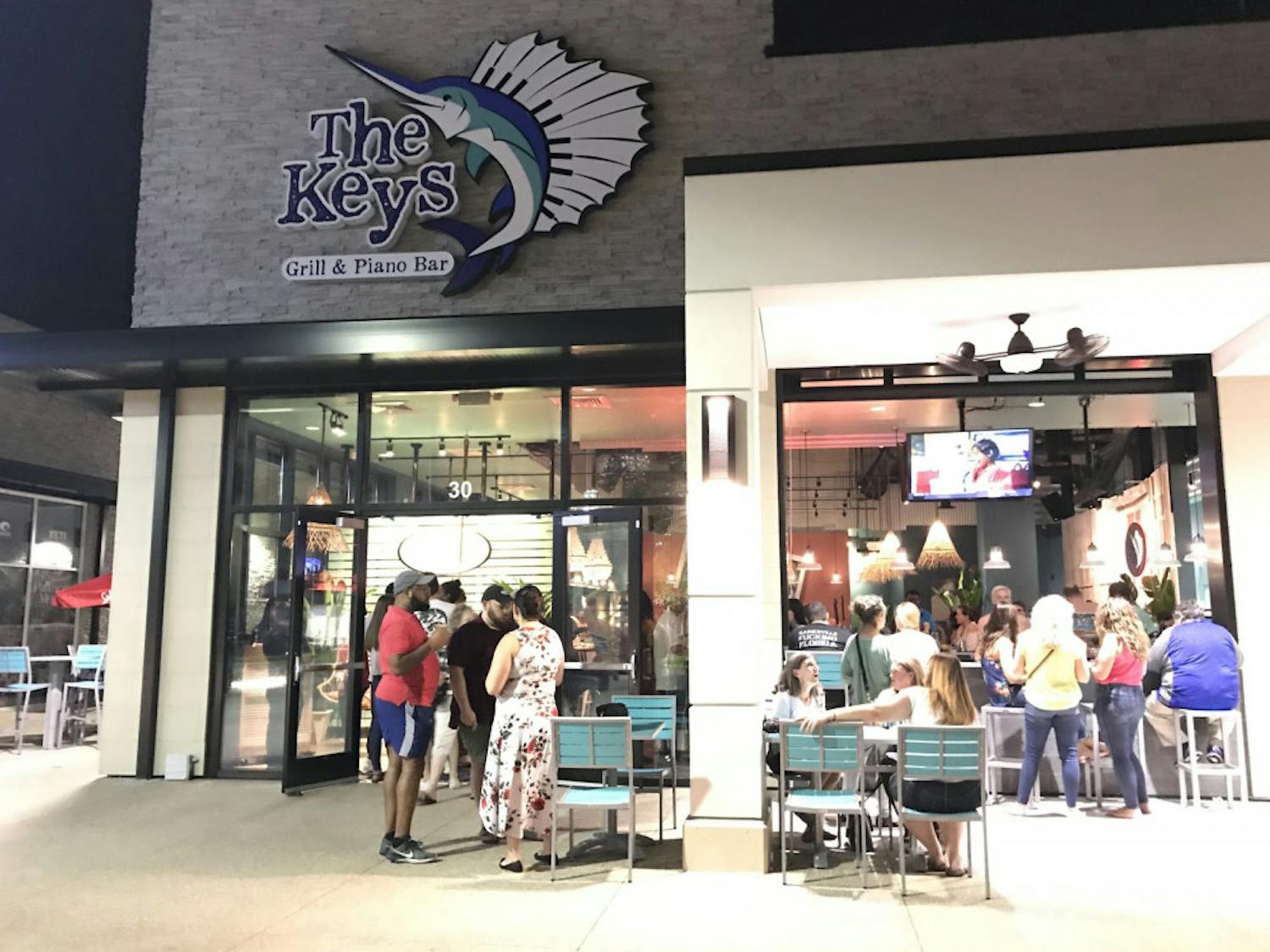 The Keys, a new seafood restaurant and entertainment venue, held its grand opening at Celebration Pointe on Wednesday evening. Originally scheduled to open on Sept. 2, the date was pushed back due to Hurricane Dorian. 