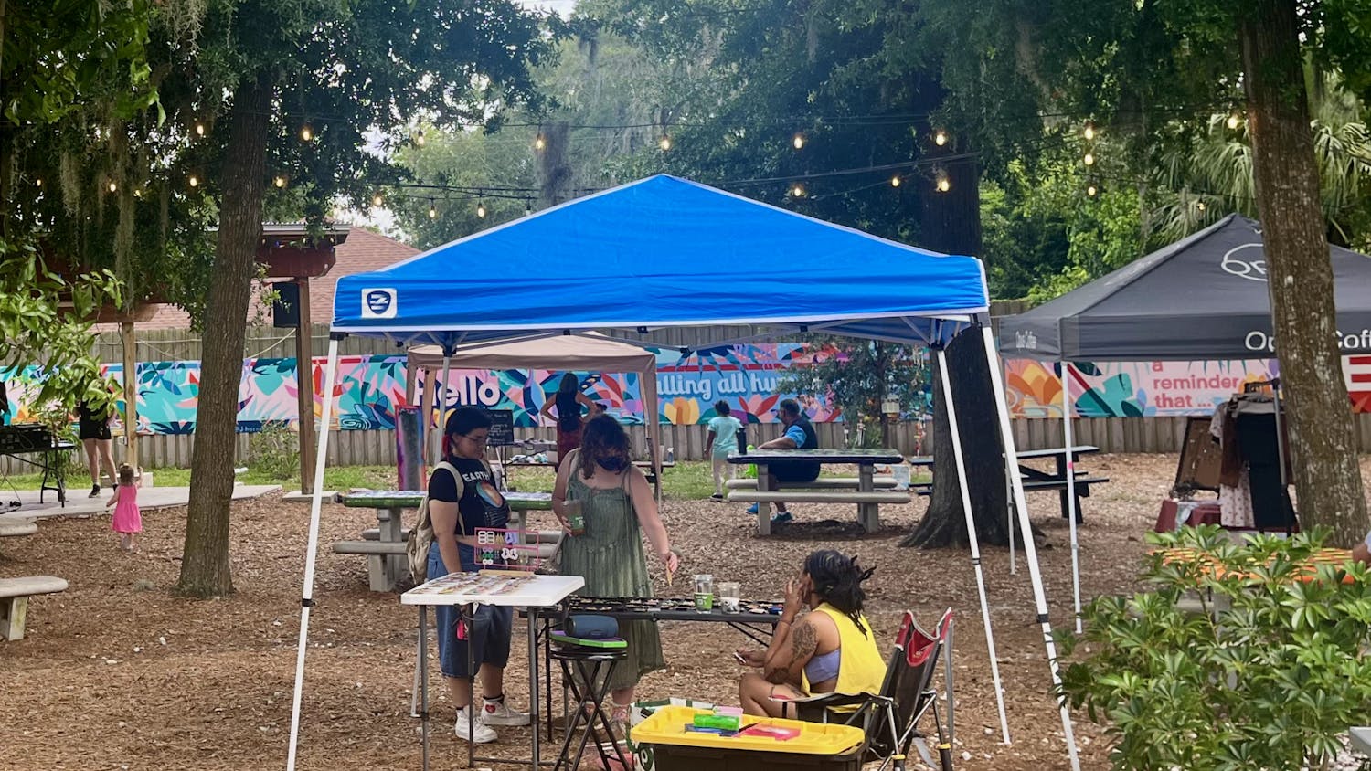 Market attendees explore the work of local artists at 4th Ave Food Park on Monday, June 19, 2023. 