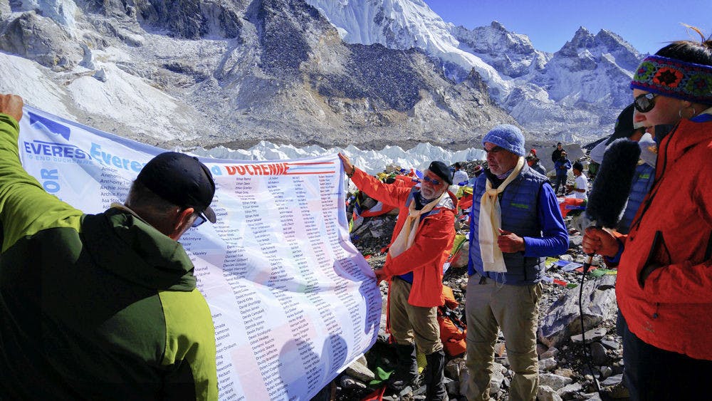 <p>Standing on Mt. Everest, the group of climbers for Everest to End Duchenne, led by Tanya Dreher, post the Hope-Memory flag with the names of 750 boys and girls who had or have Duchenne Muscular Dystrophy, a terminal, degenerative disorder without a cure.</p>