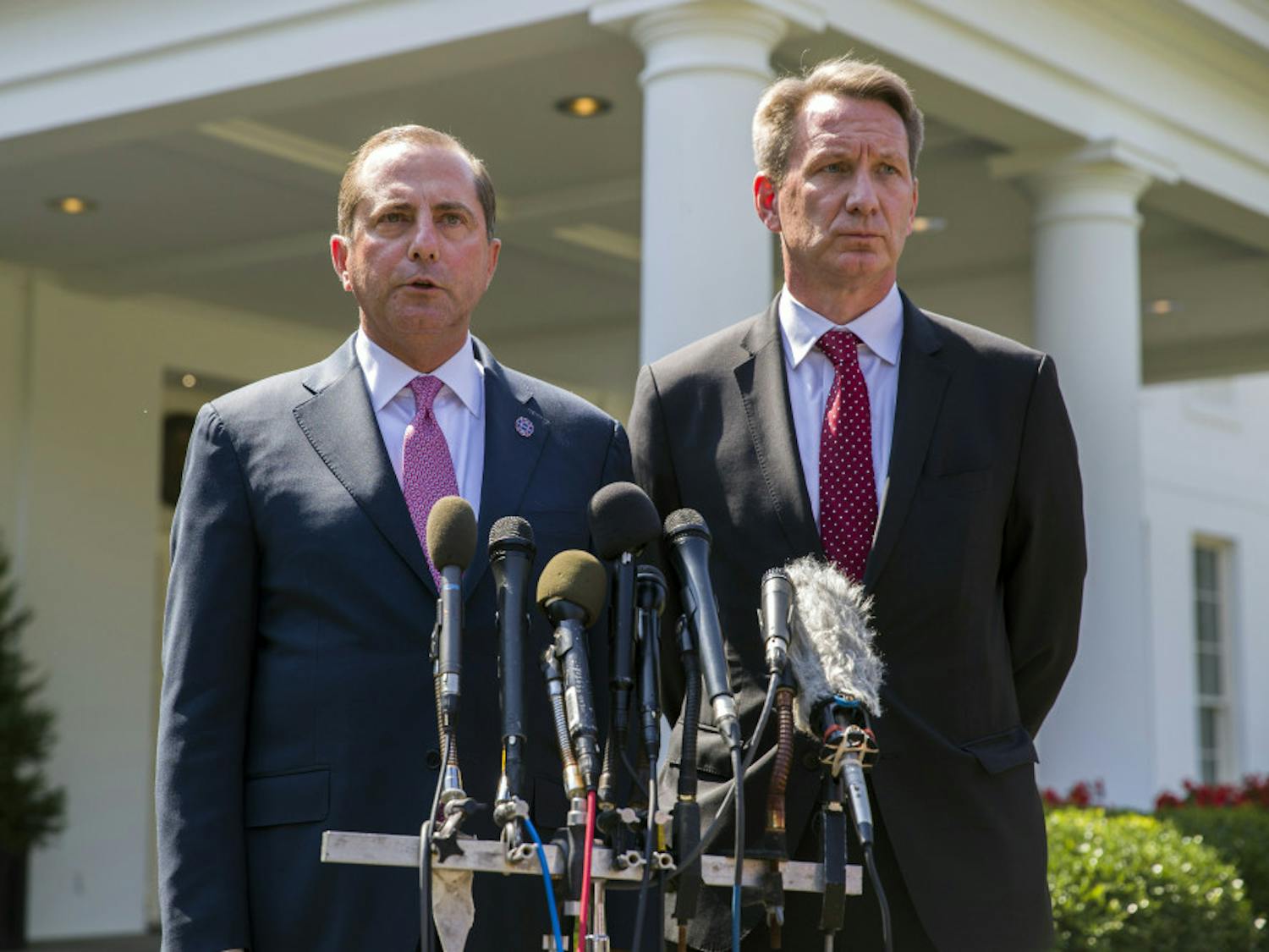 Health and Human Services Secretary Alex Azar, left, and acting FDA Commissioner Ned Sharpless speak with reporters after a meeting about vaping with President Donald Trump in the Oval Office of the White House, Wednesday, Sept. 11, 2019, in Washington. (AP Photo/Alex Brandon)