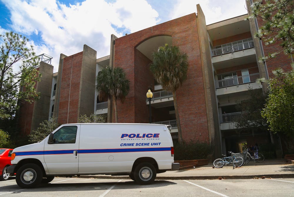 <p>A University Police Department crime scene unit vehicle sits parked outside of Little Hall on March 10, 2016.</p>