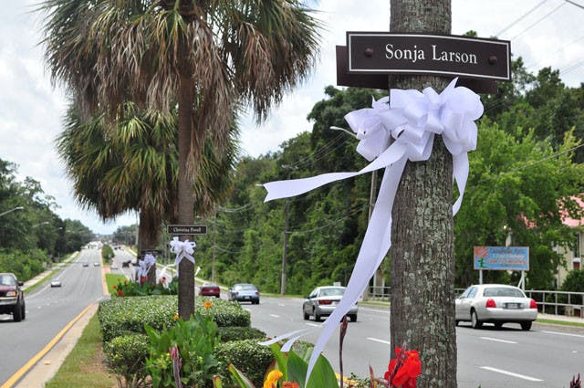 Ribbons placed in remembrance of the victims of serial killer Danny Rolling blow in the breeze on Southwest 34th Street on Thursday. Rolling murdered five students in Gainesville in late August 1990.