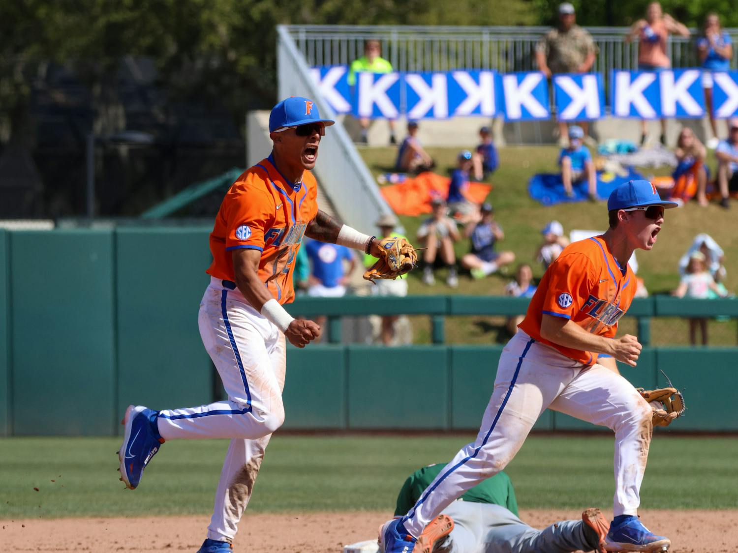 Florida infielders Josh Rivera and Cade Kurland celebrate an out in No. 6 Florida’s 14-4 mercy-rule win against the No. 22 Miami Hurricanes at Condron Ballpark Sunday, March 5, 2023